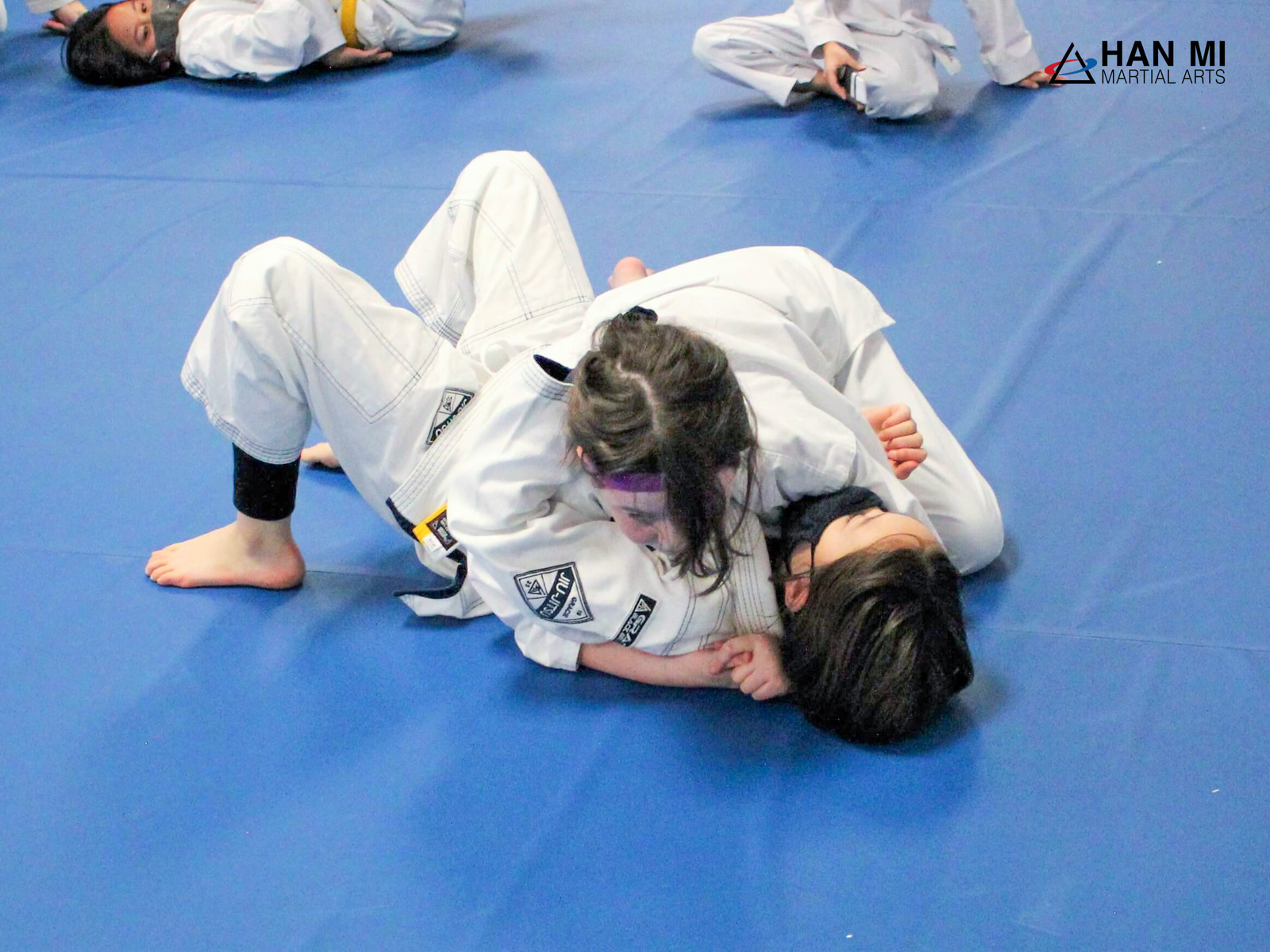 Two Youth Jiu-Jitsu students practicing on the mat