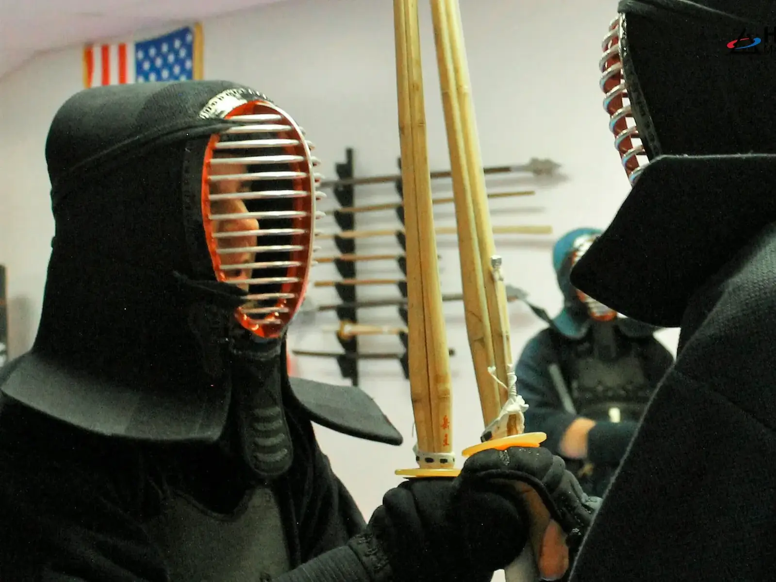 Kendo student in armor with bamboo sword