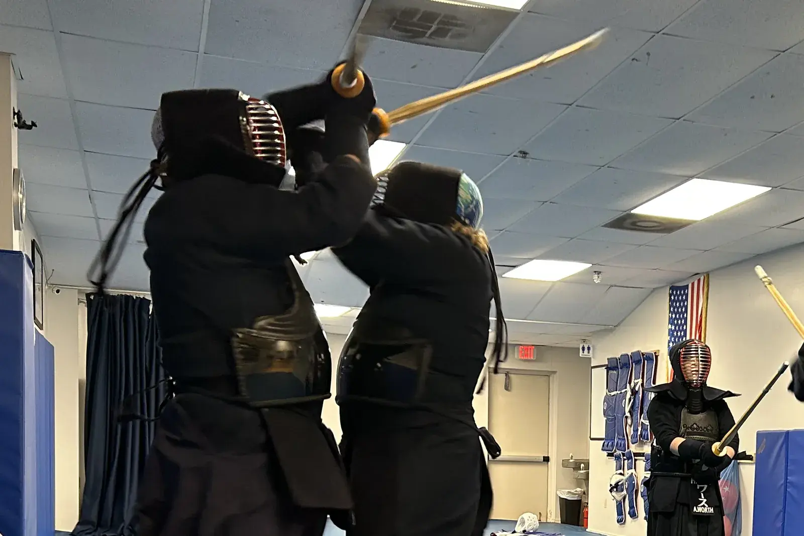 Kendo students sparring in armor