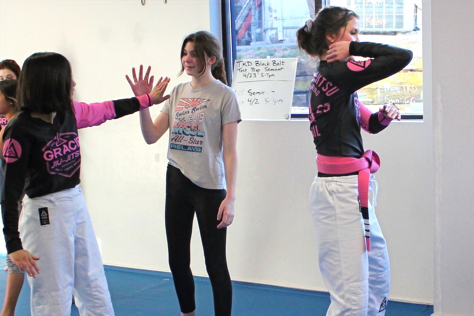 Women practicing palm strikes in self-defense class