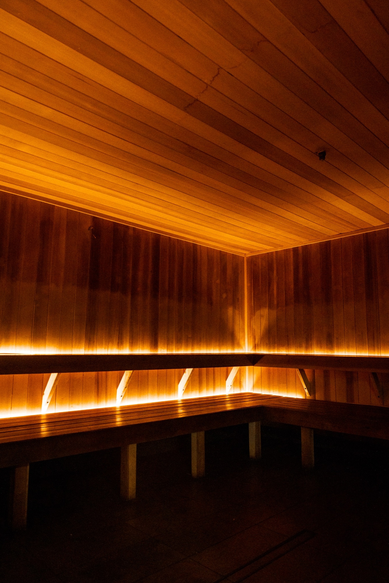 Warm wood interior of the sauna at ALL-ONE GYM