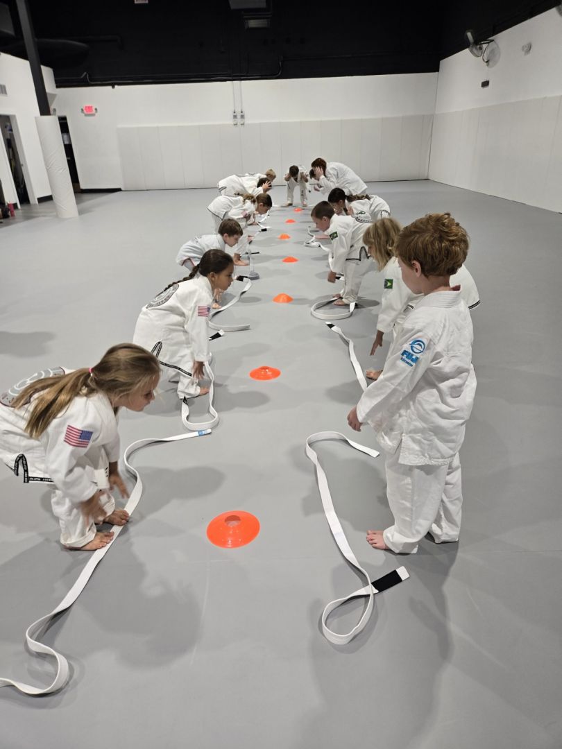 Little Grapplers class drilling on the mat