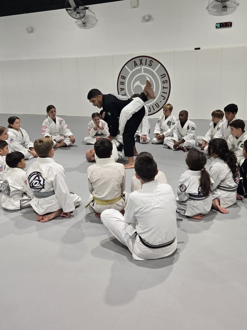 Kids class listening to their coach at Axis