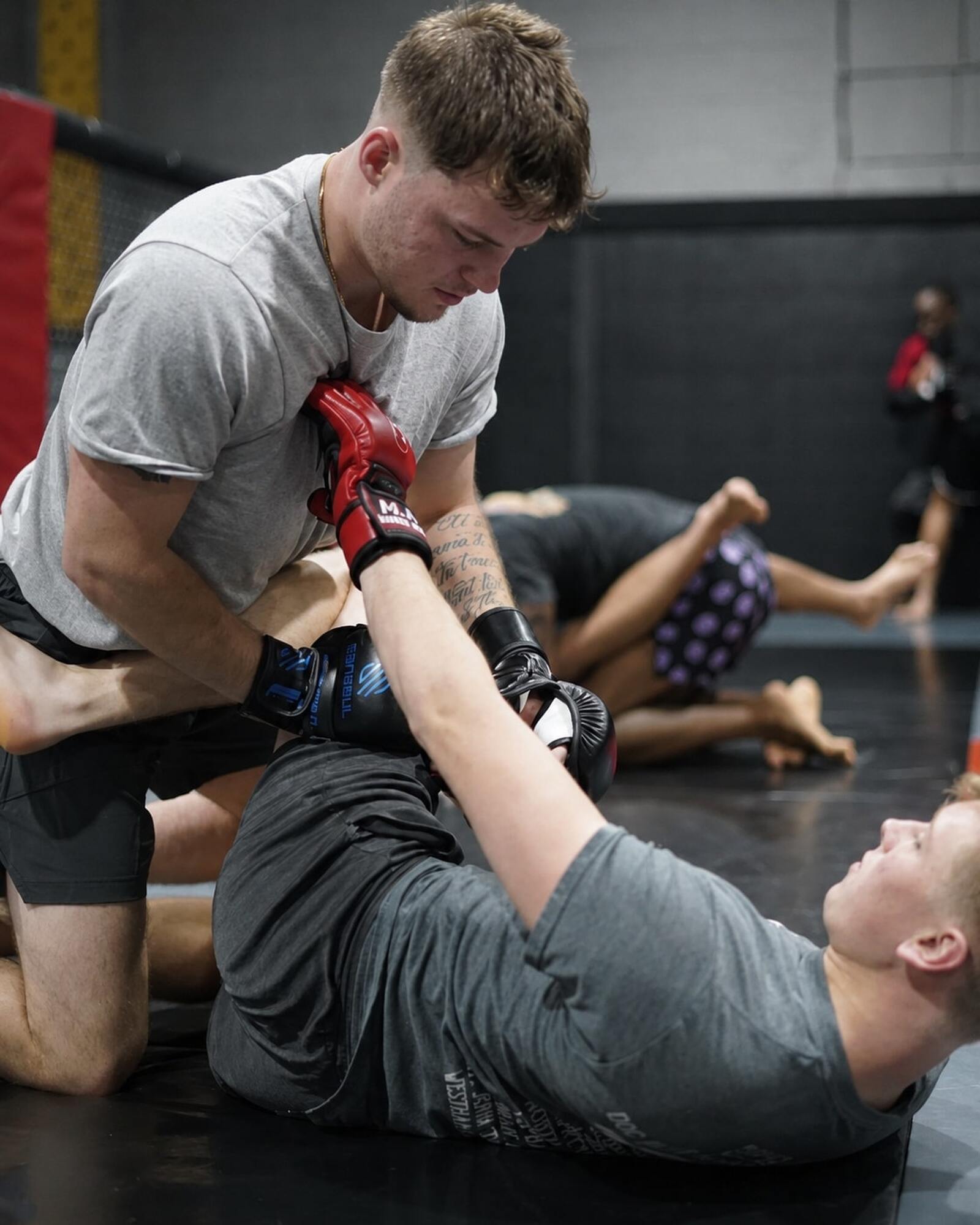Two men practicing MMA grappling