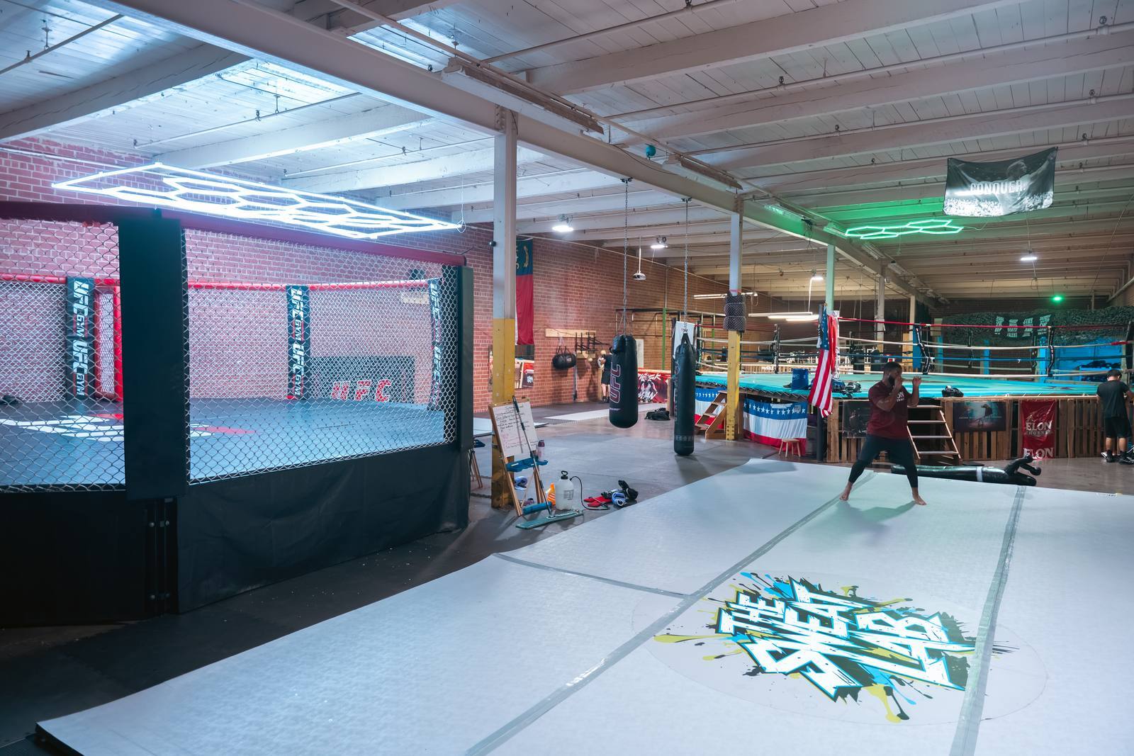 The Sweat Lab's MMA cage and mats