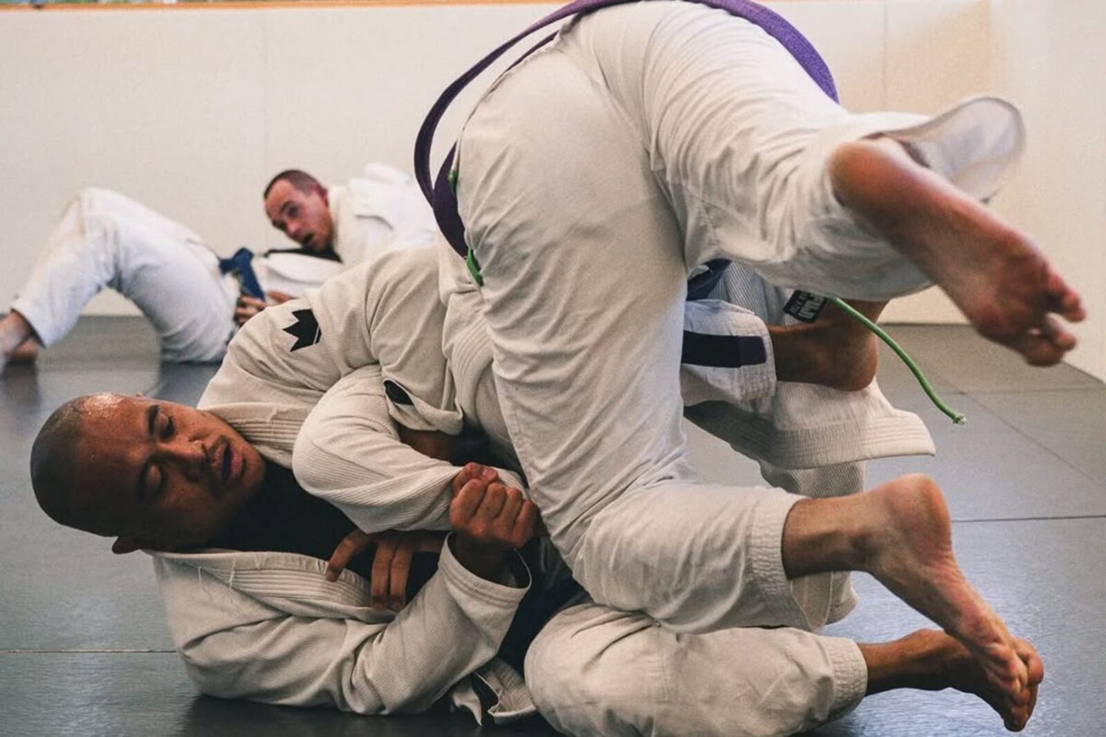 BJJ belt promotion at Shibusa Jiu Jitsu Studio Canberra — coach with student