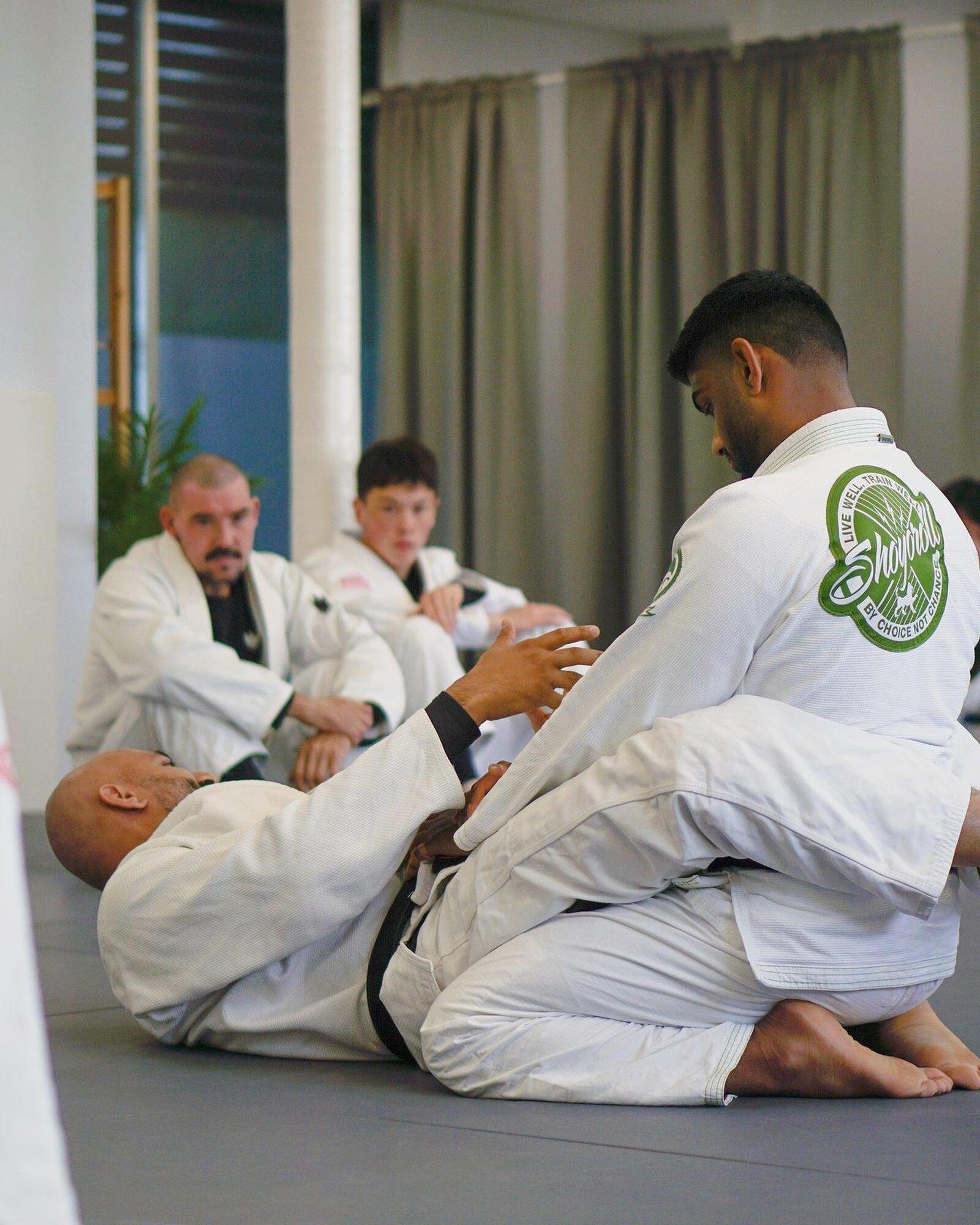 Learning Brazilian Jiu Jitsu technique in class