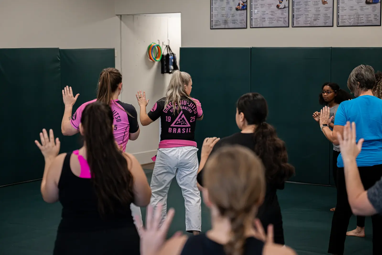 Women practicing during a self-defense workshop