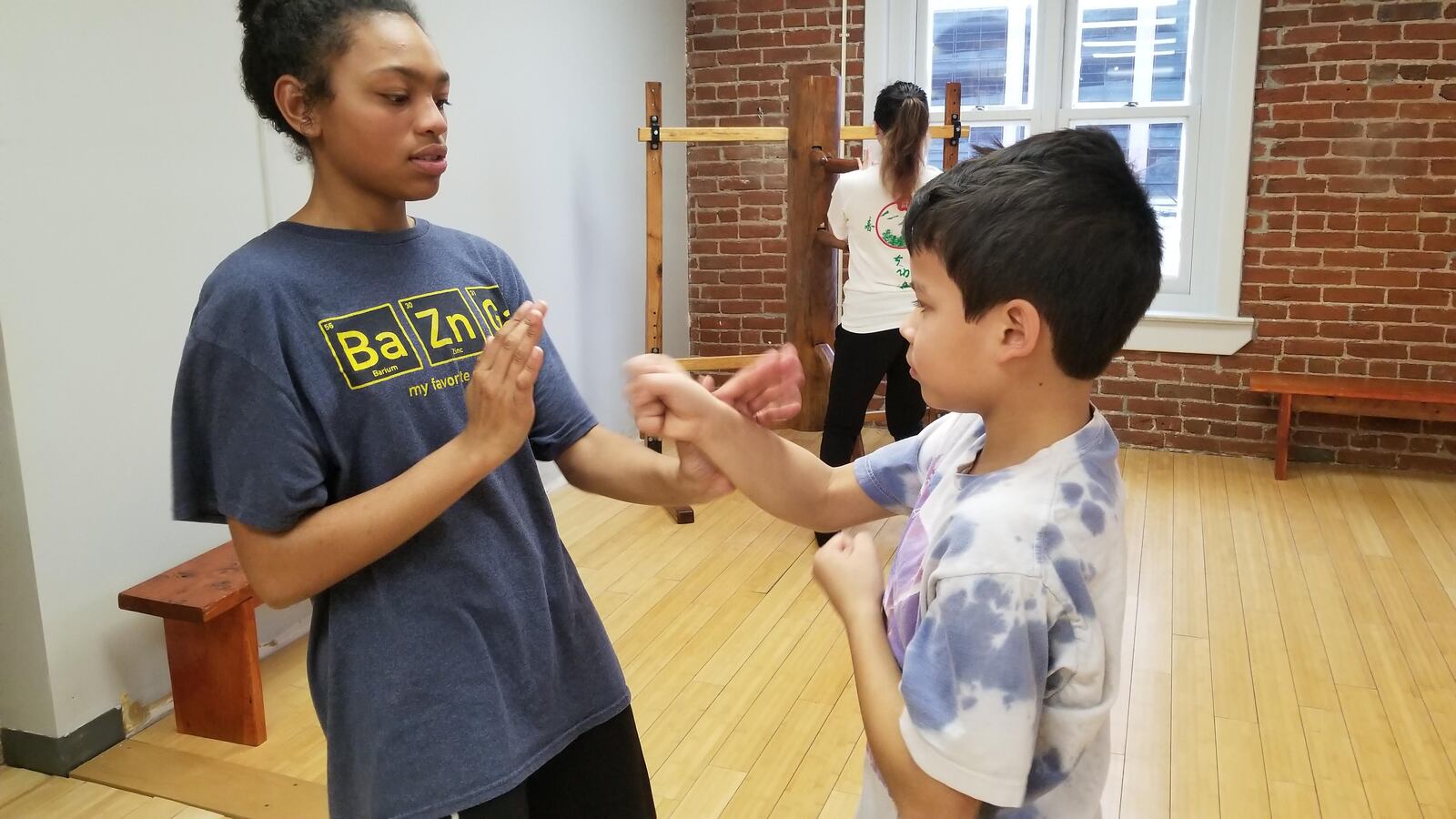 A child taking an introductory kung fu lesson