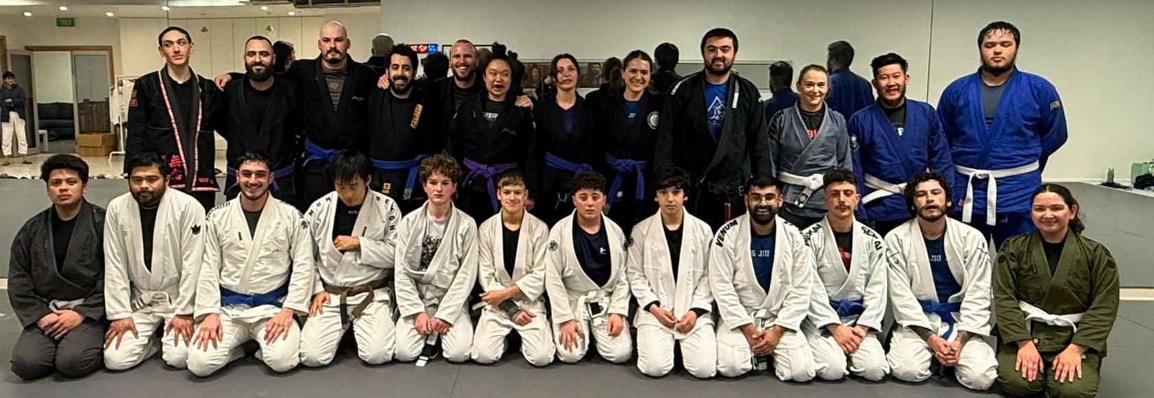 Focus Jiu Jitsu members together on the mats at our Mill Park academy