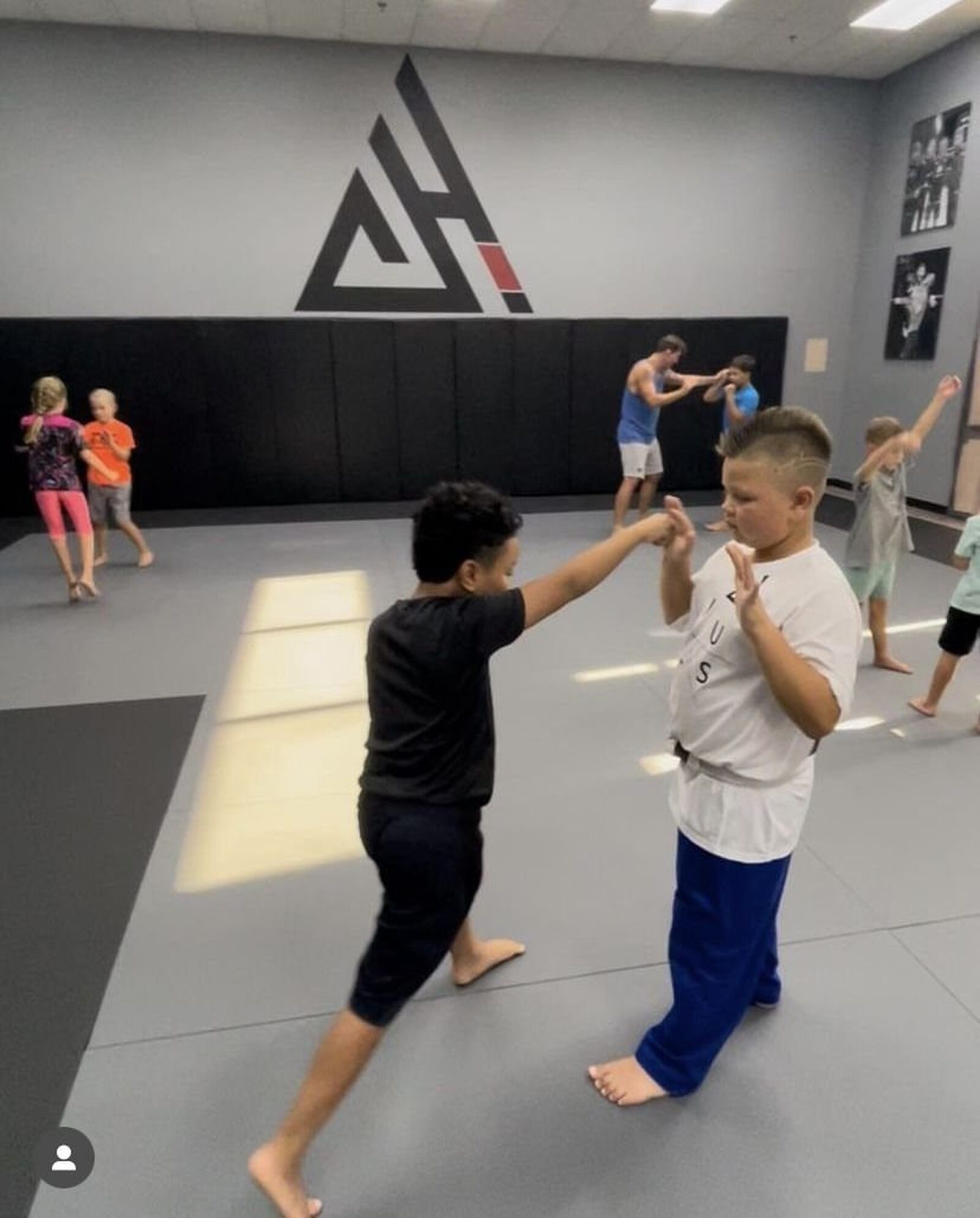 Kids practicing striking in pairs