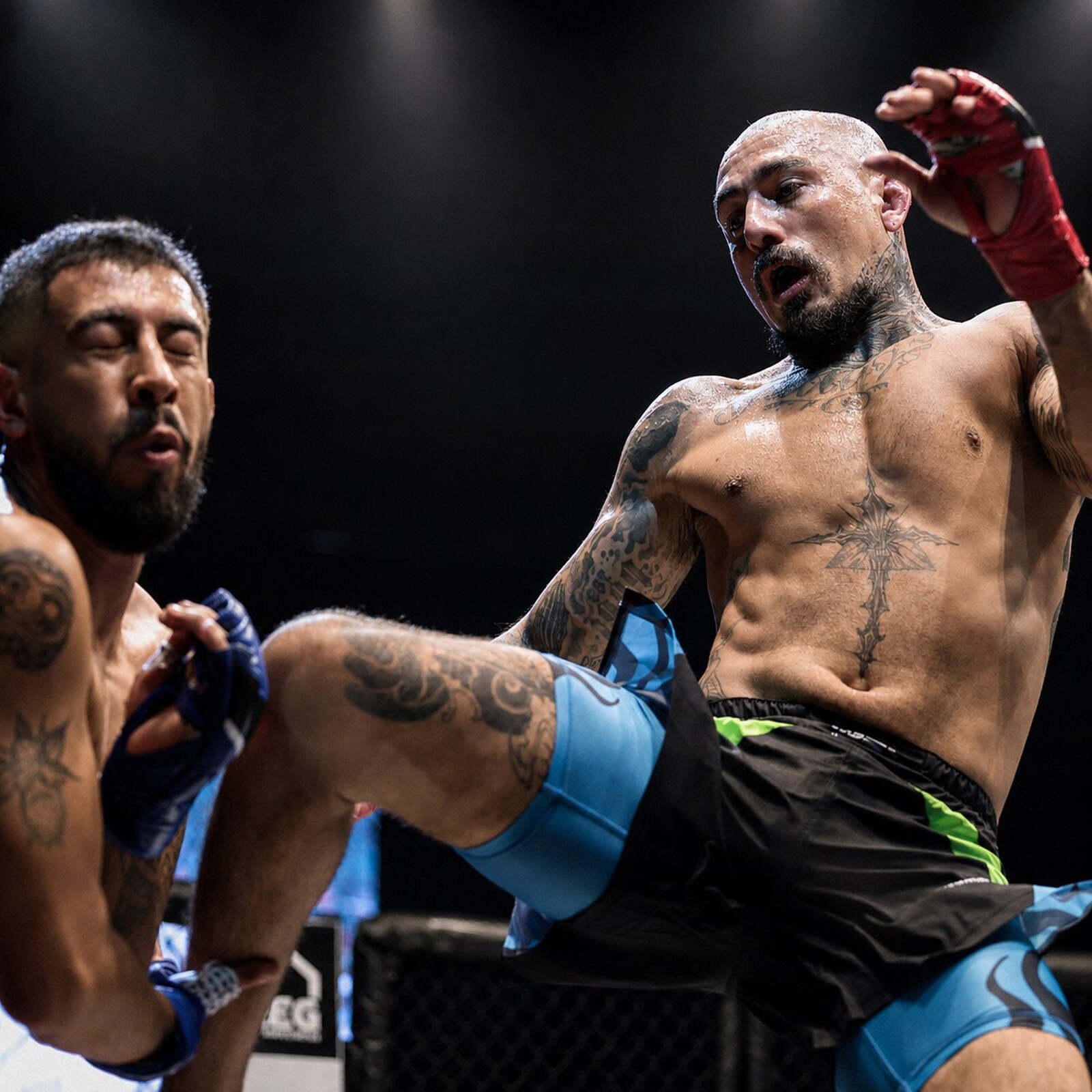 SVG MMA Academy: fight night, Coach Ricky 'Savage' driving a knee/kick in close on fight night