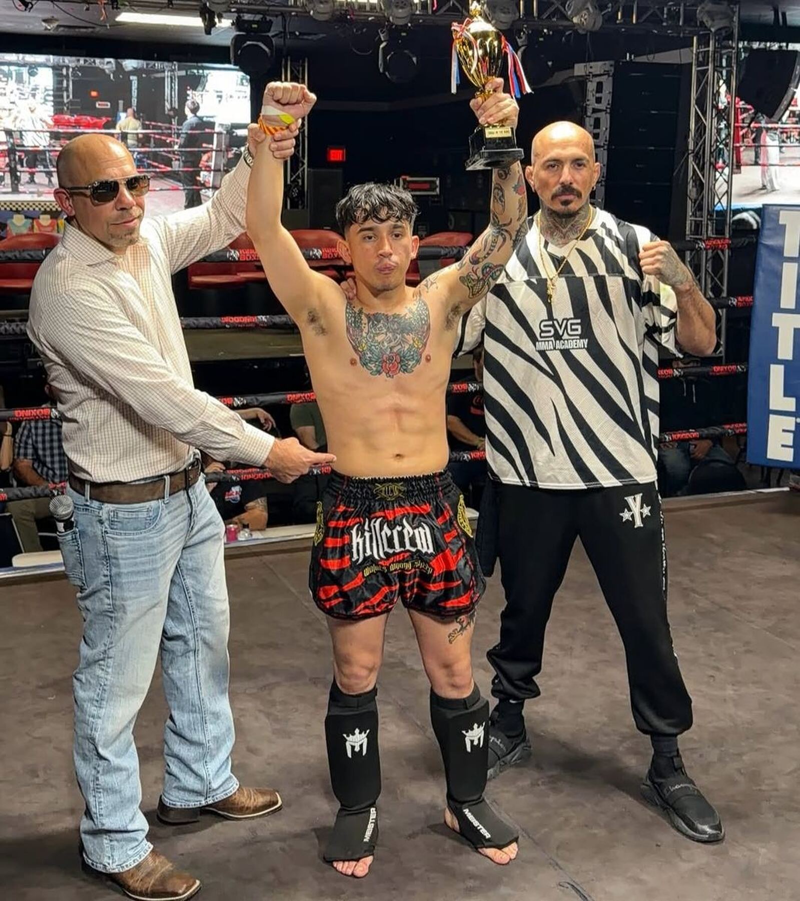 SVG MMA Academy: winning, Hand raised with the trophy after a Muay Thai debut win (opponent did not come out for round 2)