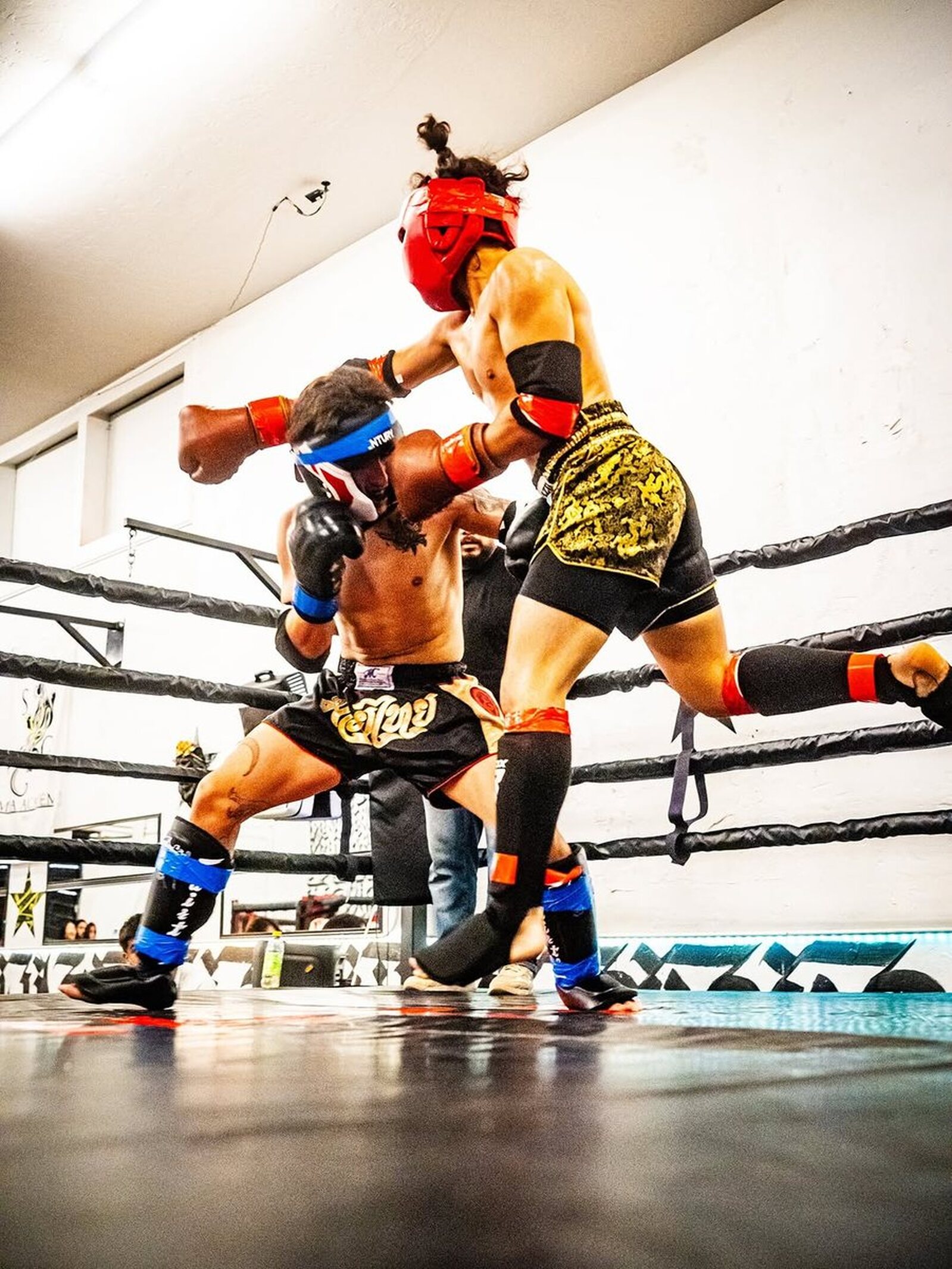 SVG MMA Academy: fight action, Primal Instinct Championships win: mid-exchange in the ring, both committed