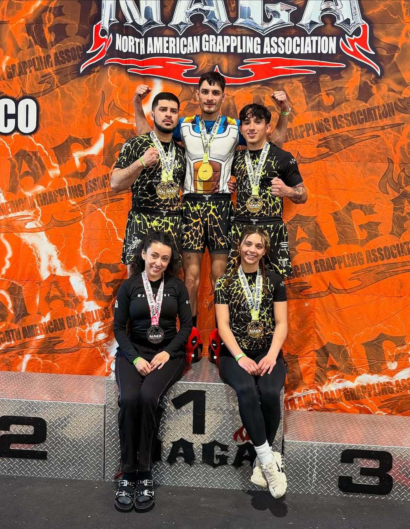 Team SVG on the NAGA podium after going undefeated with 5 golds and 1 silver