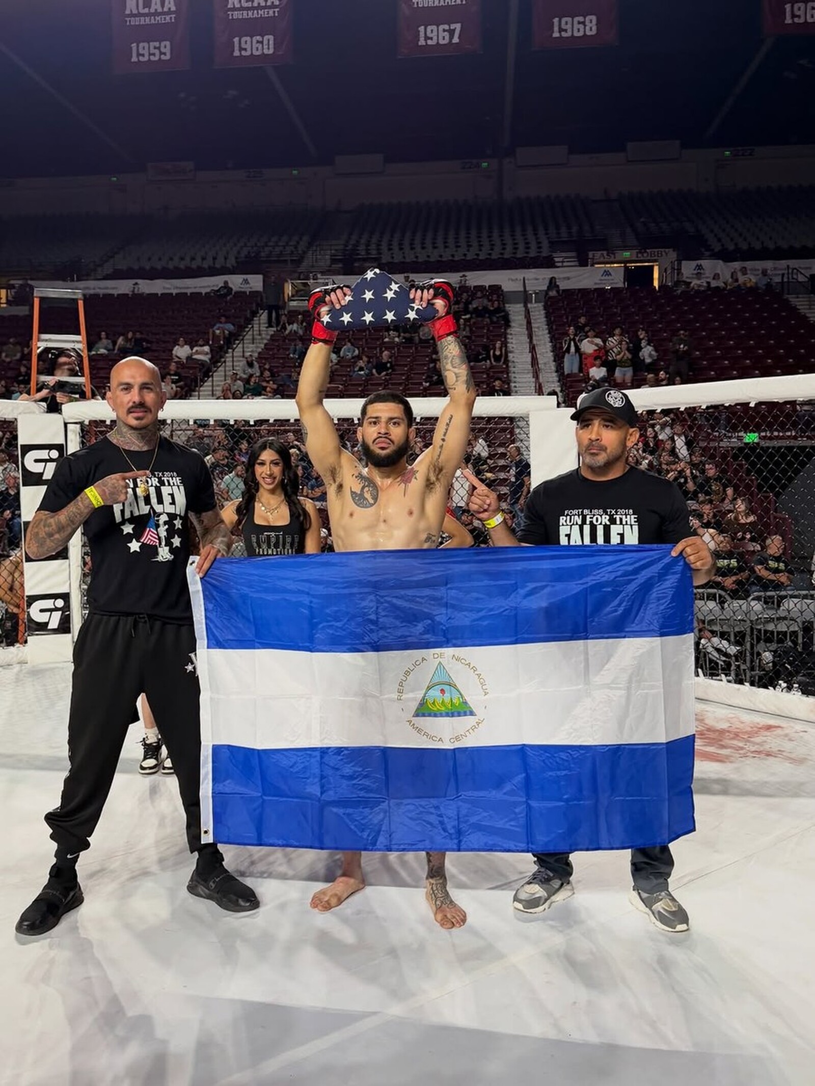 SVG MMA Academy: winning, AJ goes 2-0 with a rear-naked-choke win, flag held high in the arena cage