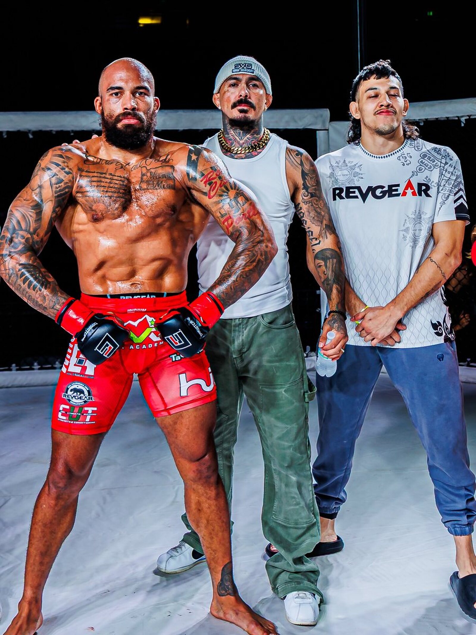 SVG MMA Academy fighter with his corner in the cage after a fight